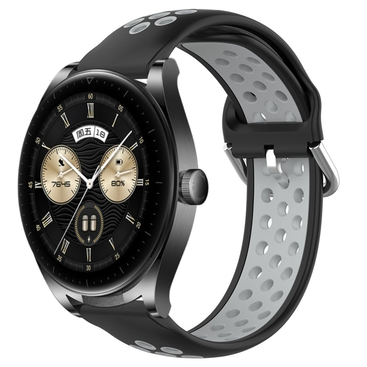 Black and gray perforated silicone sports watch band with vent holes and buckle tabs