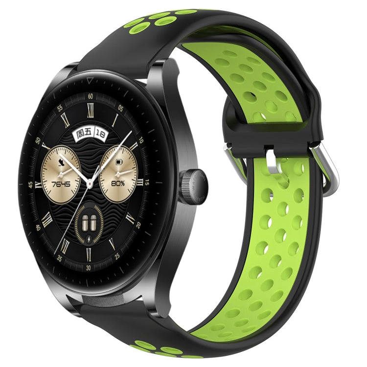 Black and lime green perforated silicone sports watch band with vent holes and buckle tabs
