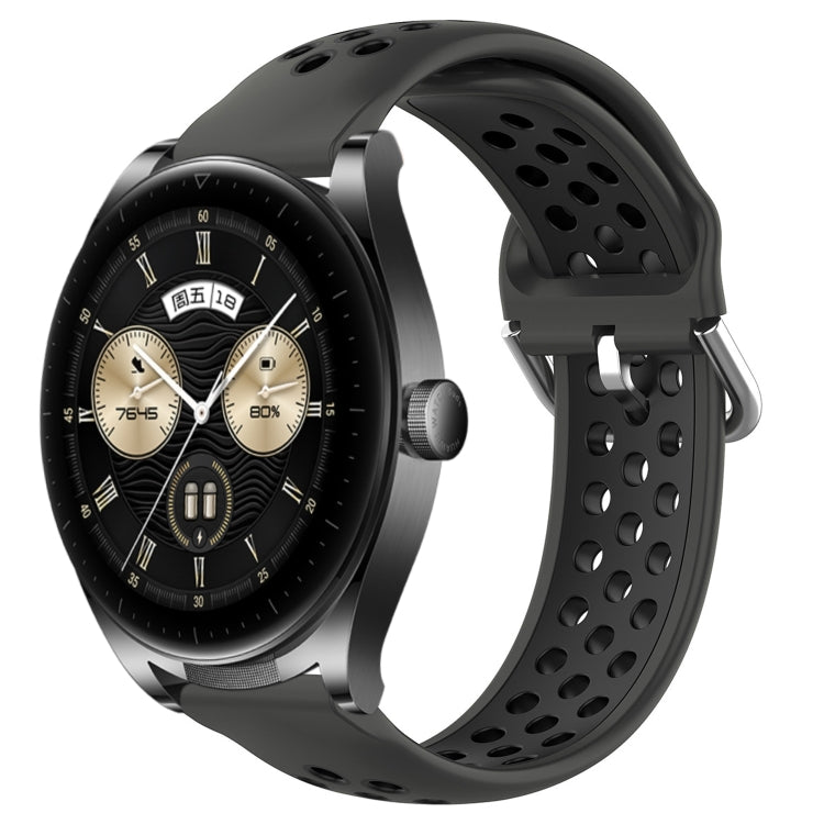 Black perforated silicone sports watch band with vent holes and adjustable buckle tabs