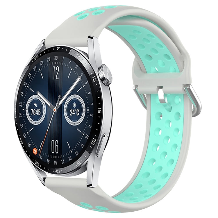 Light gray perforated silicone sports watch band with mint teal strap holes and buckle