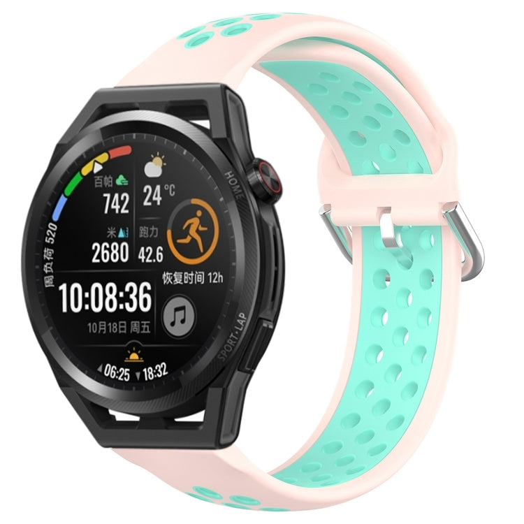 Blush pink perforated silicone sports watch band with mint teal inside holes and buckle