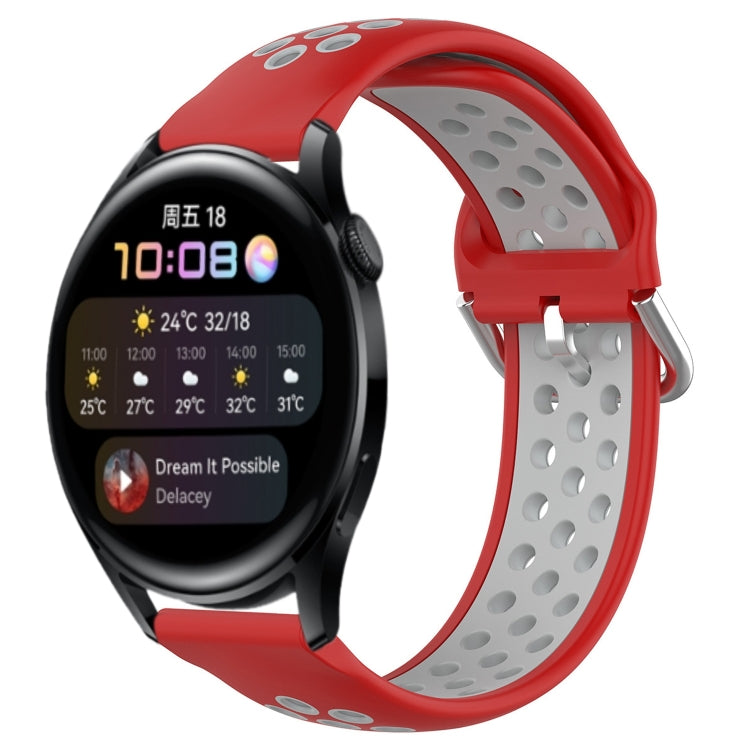 Perforated silicone sports watch band, red with metal clasp and gray underside.