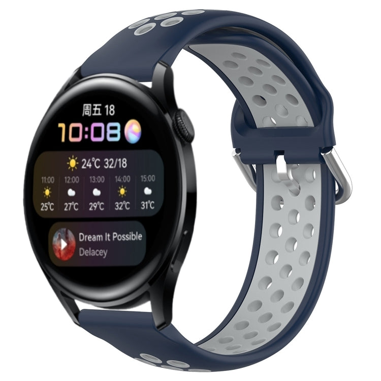Perforated silicone sports watch band, navy blue with metal clasp and gray underside.
