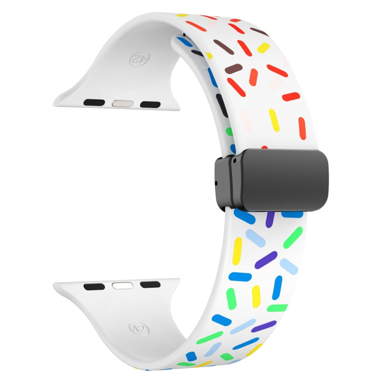 White silicone watch band with rainbow dots and black magnetic buckle, side view