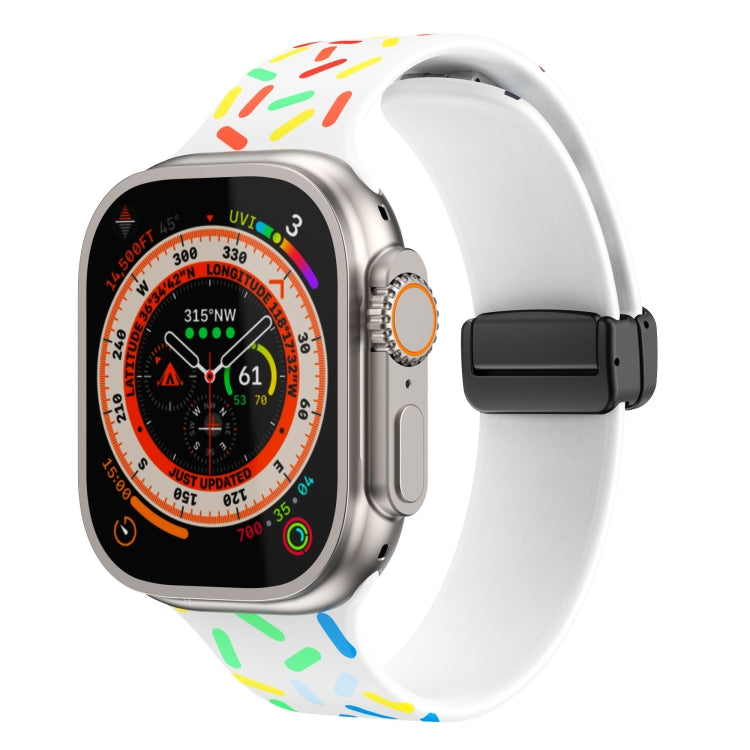 Silicone Apple Watch band with rainbow dots, white strap, black magnetic buckle clasp