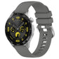 Silicone watch band with silver buckle, dark gray glossy finish, vented strap holes.