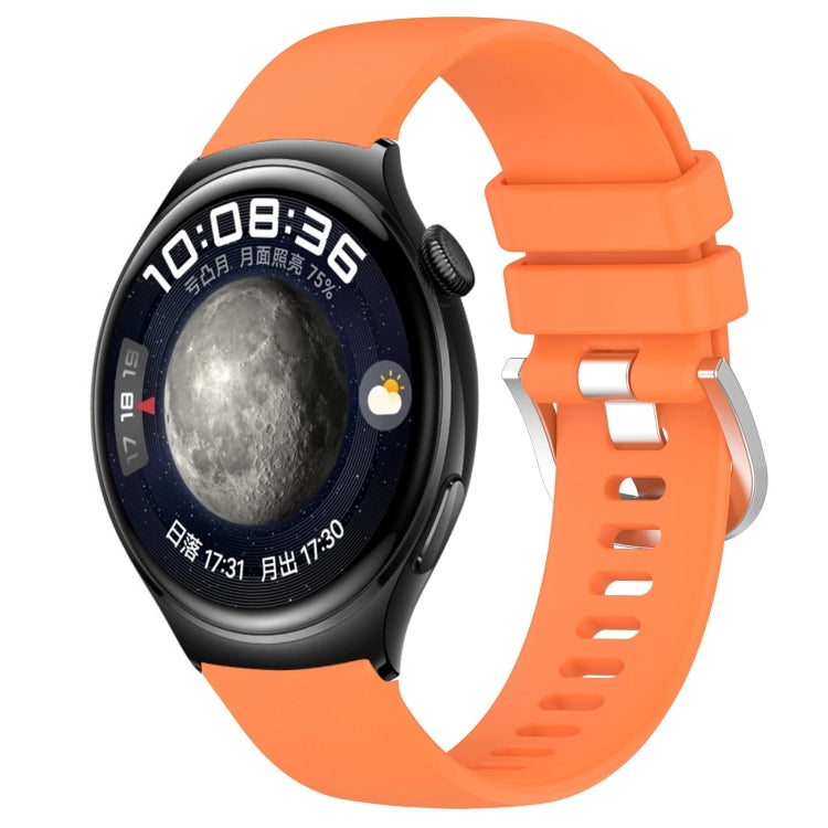 Glossy silicone watch band with silver buckle, bright orange strap with pin holes