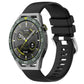 Glossy silicone watch band with silver buckle clasp, black strap with pin holes