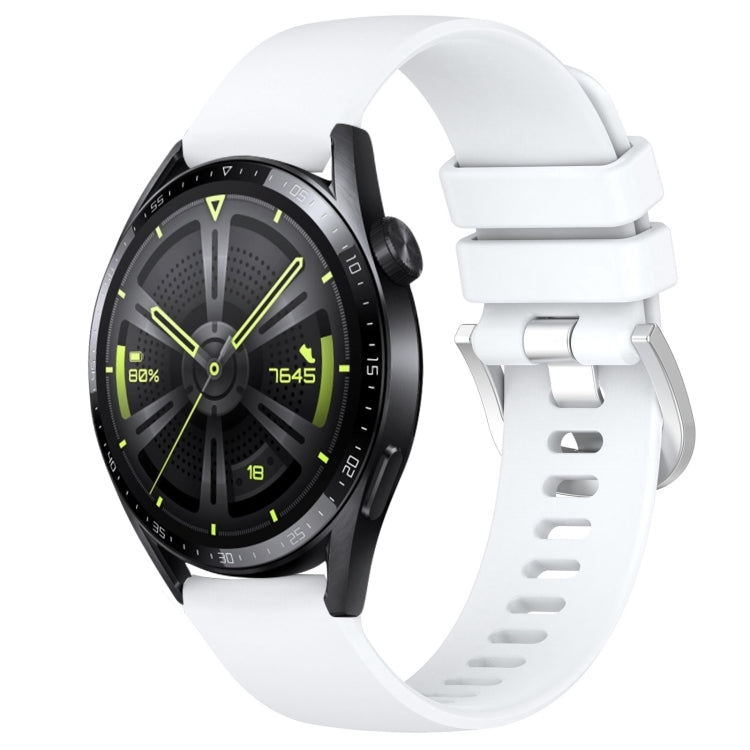 White silicone watch band with silver-tone buckle and adjustment holes, glossy finish.