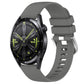 Glossy dark gray silicone watch band with silver buckle, punched holes, curved ends.