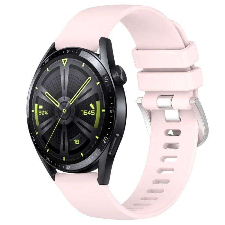 Glossy light pink silicone watch band with silver buckle, punched holes, curved ends.