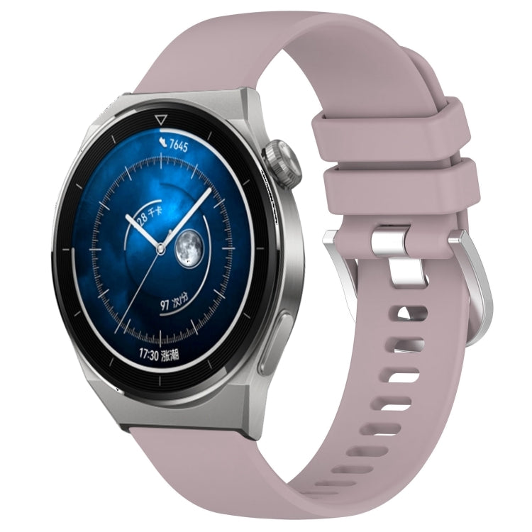 Purple silicone watch band with silver-tone buckle and multiple adjustment holes, glossy look.