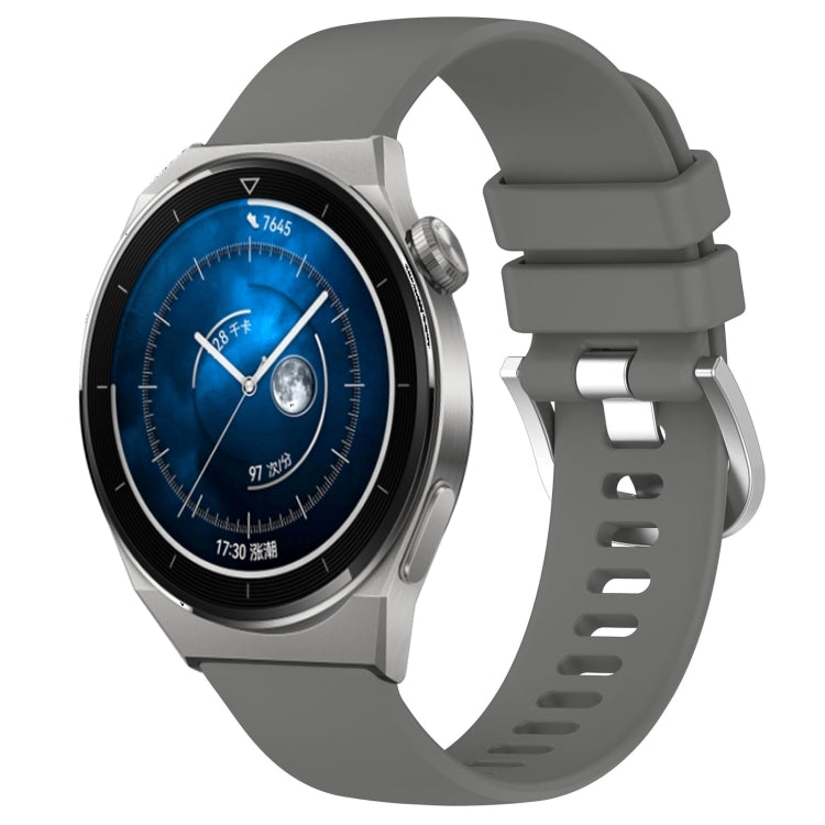 Dark gray silicone watch band with silver-tone buckle and adjustable holes, glossy finish.
