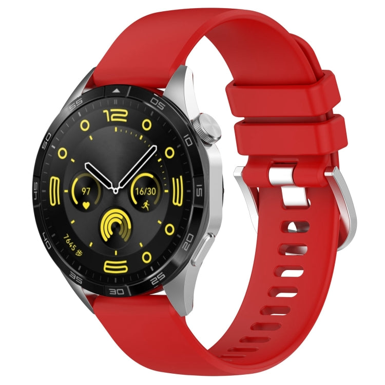 Silicone watch band with silver buckle, red glossy finish, vented strap holes.