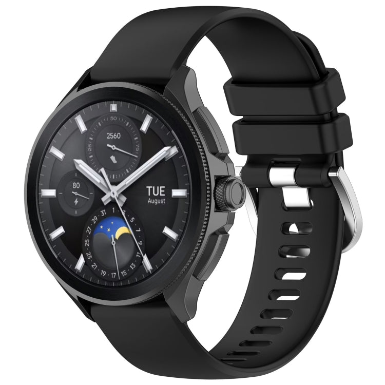 Glossy black silicone watch band with a sport buckle and perforated strap holes.