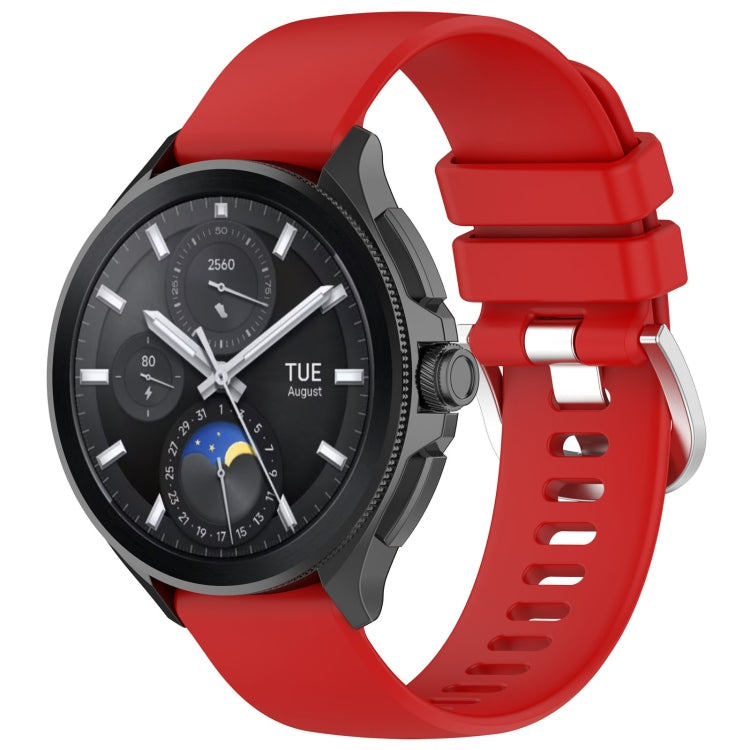 Red glossy silicone watch band with sport buckle and perforated strap holes.