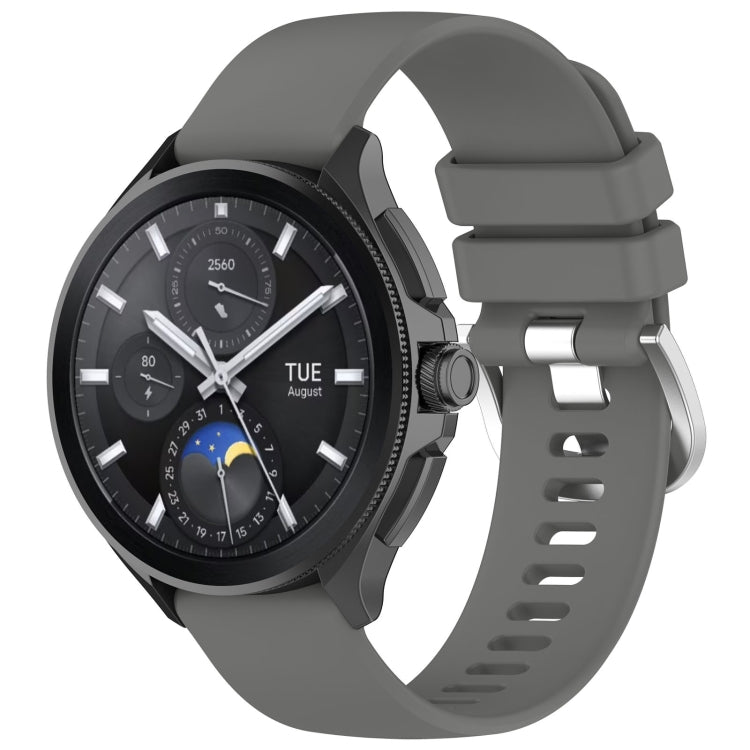 Dark gray glossy silicone watch band with sport buckle and perforated strap holes.