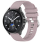 Purple-pink glossy silicone watch band with sport buckle and perforated strap holes.