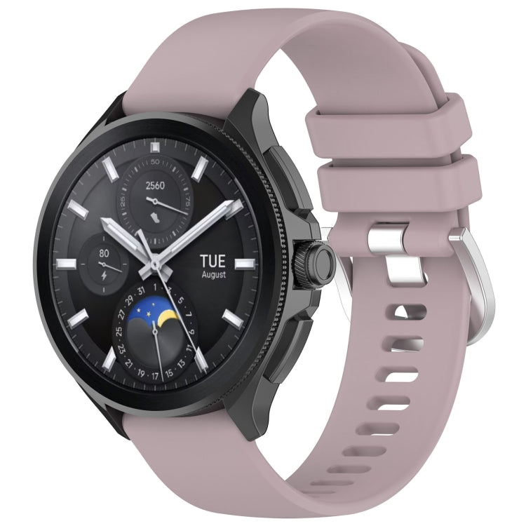 Purple-pink glossy silicone watch band with sport buckle and perforated strap holes.