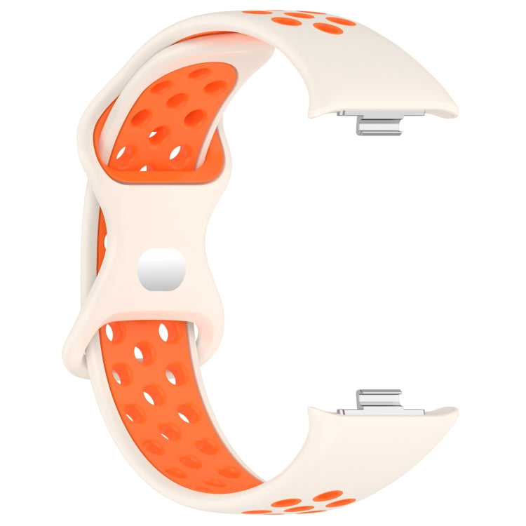 Dual-color perforated silicone watch band, cream with orange perforated accents.