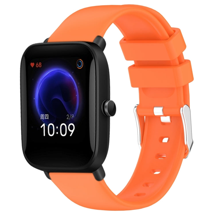 Orange silicone watch band with three-hole strap and metal buckle adapter
