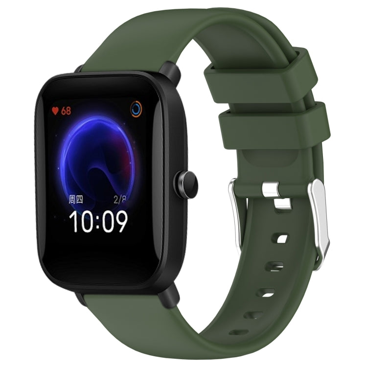 Olive green silicone watch band with adjustable holes and metal clasp.