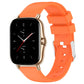 Orange silicone watch band with adjustable holes and metal clasp.