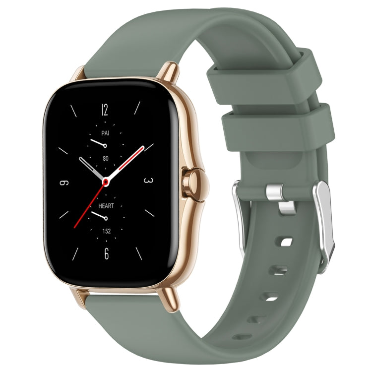 Olive green silicone watch strap with side connector and adjustable holes.