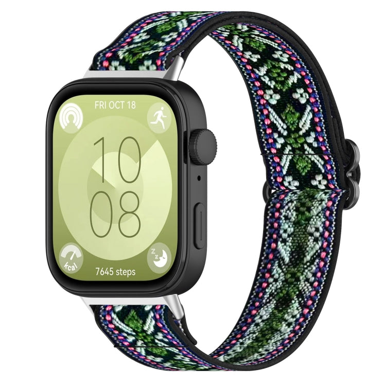 Floral-pattern elastic nylon watch band in green, blue, and pink, attached to a smartwatch.