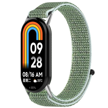 Pale green nylon hook-and-loop watch band fitted to a fitness tracker