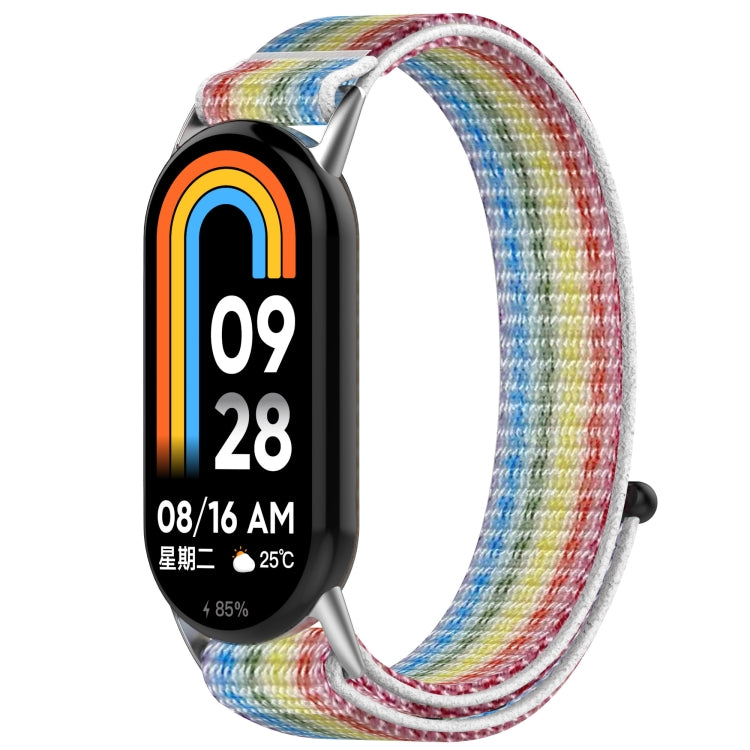 Multicolor nylon hook-and-loop watch band fitted to a fitness tracker