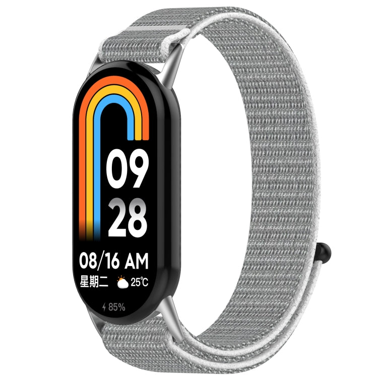 Gray nylon hook-and-loop watch band with a silver edge, shown on a fitness tracker.