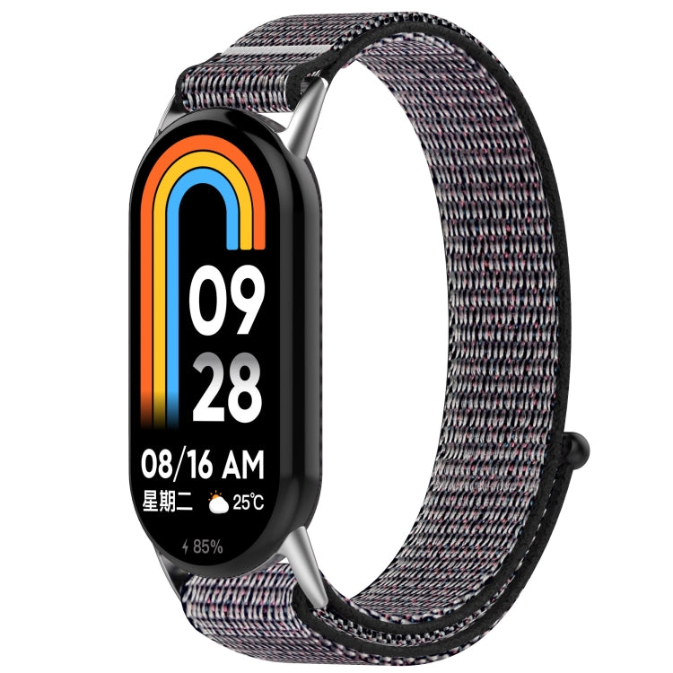 Black and gray patterned nylon hook-and-loop watch band with pink flecks.