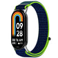 Navy nylon hook-and-loop watch band with bright lime edging, shown on a fitness tracker.