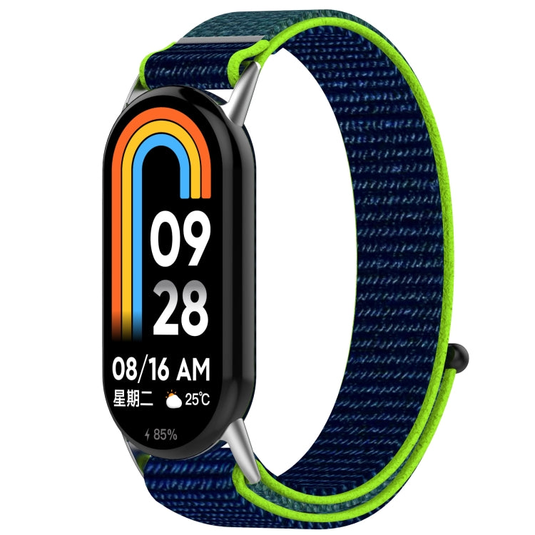 Navy nylon hook-and-loop watch band with bright lime edging, shown on a fitness tracker.