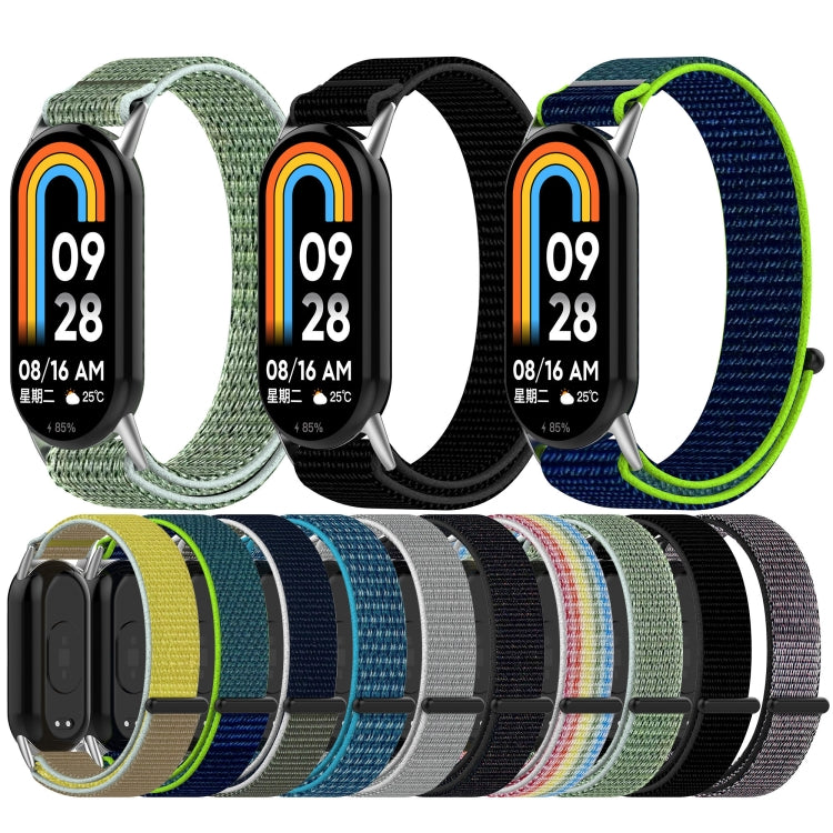 Hook-and-loop nylon watch bands in several colors, shown with and without a fitness tracker