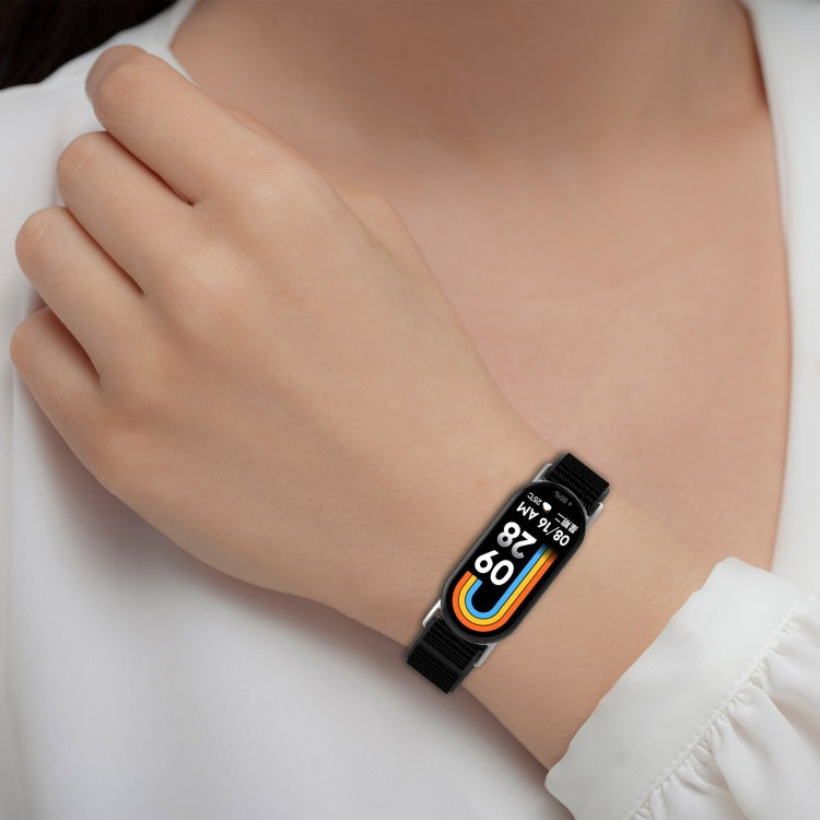 Black nylon watch band worn on a wrist