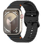 Black silicone watch band with wavy ridges, shown attached to a smartwatch