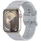 Gray silicone watch band with wavy ridges, shown attached to a smartwatch