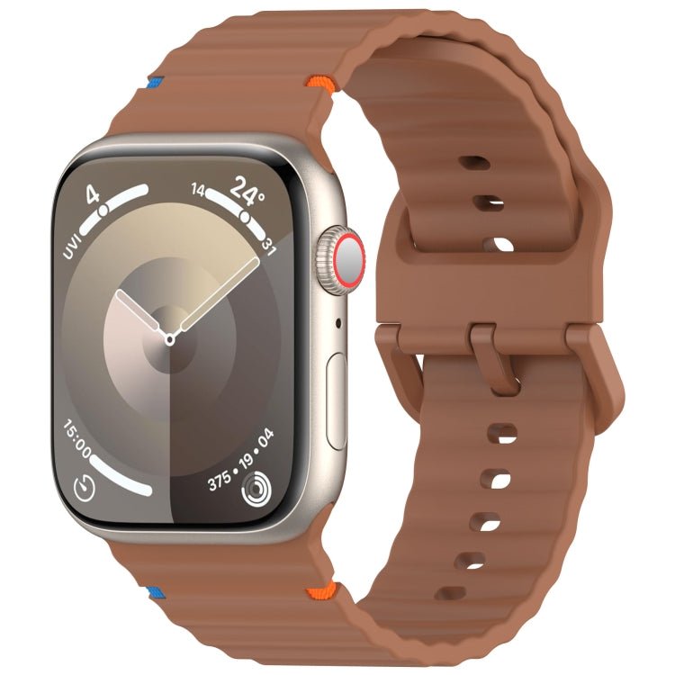 Wavy-grain silicone watch band in brown, fitted to a smartwatch