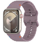 Apple Watch with a muted purple wavy-grain silicone band and stitched edges