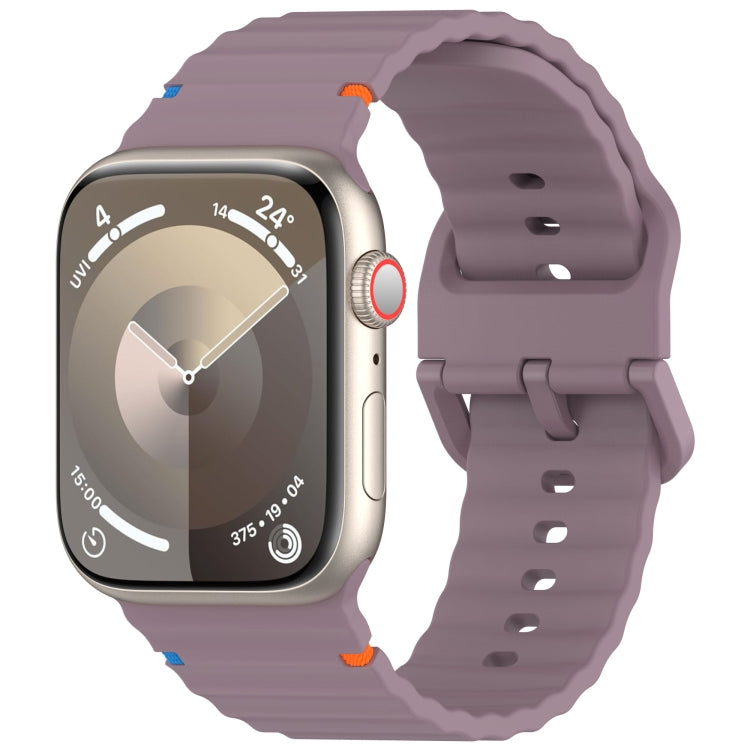Muted purple silicone Apple Watch band with wavy ridges and adjustable holes