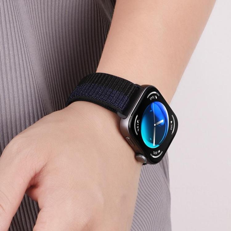 Dark navy nylon loop watch band worn on a wrist