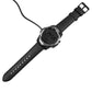 Smartwatch with black strap shown with magnetic charging cable and puck