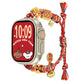 Multicolor braided Apple Watch band with red-and-gold fortune charms, shown on a watch