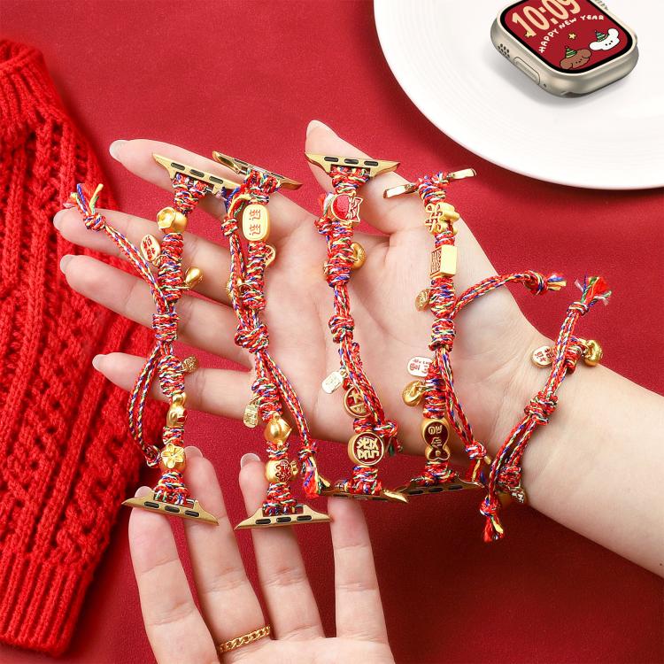 Five red multicolor braided Apple Watch bands with dangling charms, held in a hand