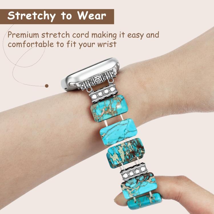 Turquoise bead watch band stretched around a wrist, with silver-tone spacers