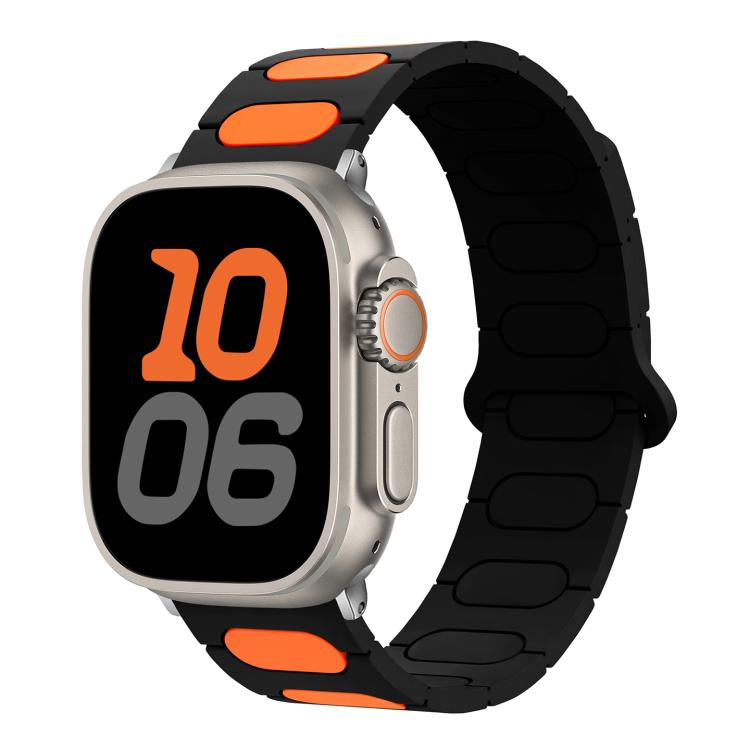 Oval magnetic silicone watch band in black with orange accents, shown on a smartwatch