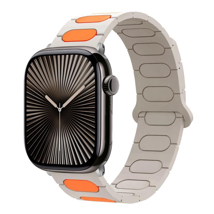 Light gray silicone watch band with bright orange oval insets on an Apple Watch.
