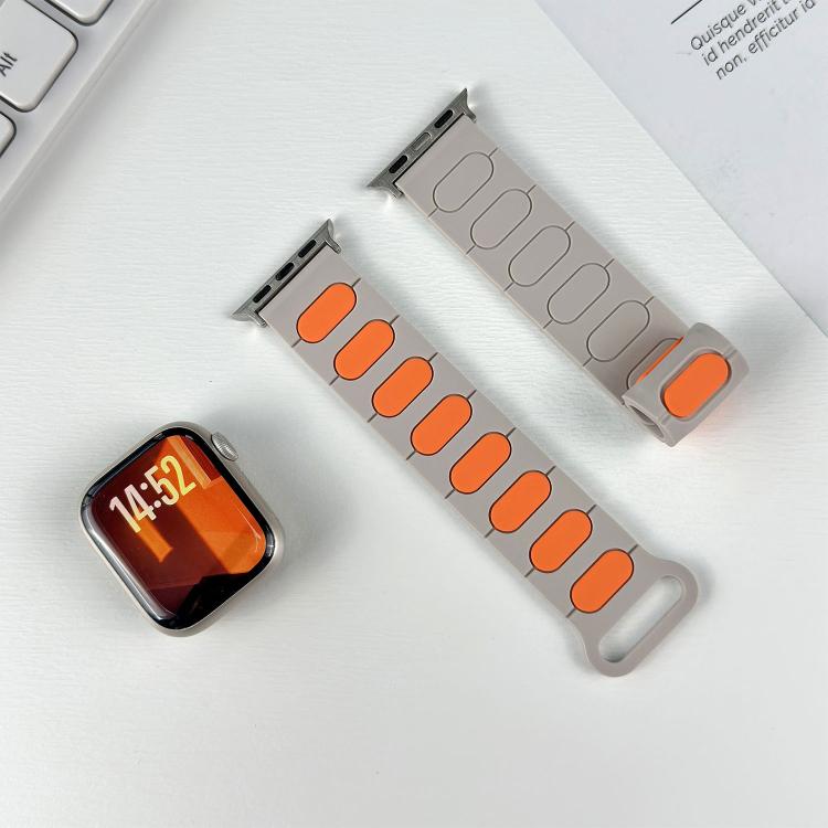 Separate light gray silicone band halves with orange or matching oval insets.